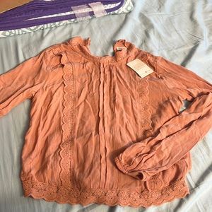 Dusky orange blouse top, from self Esteem with pretty lace bordering the top.